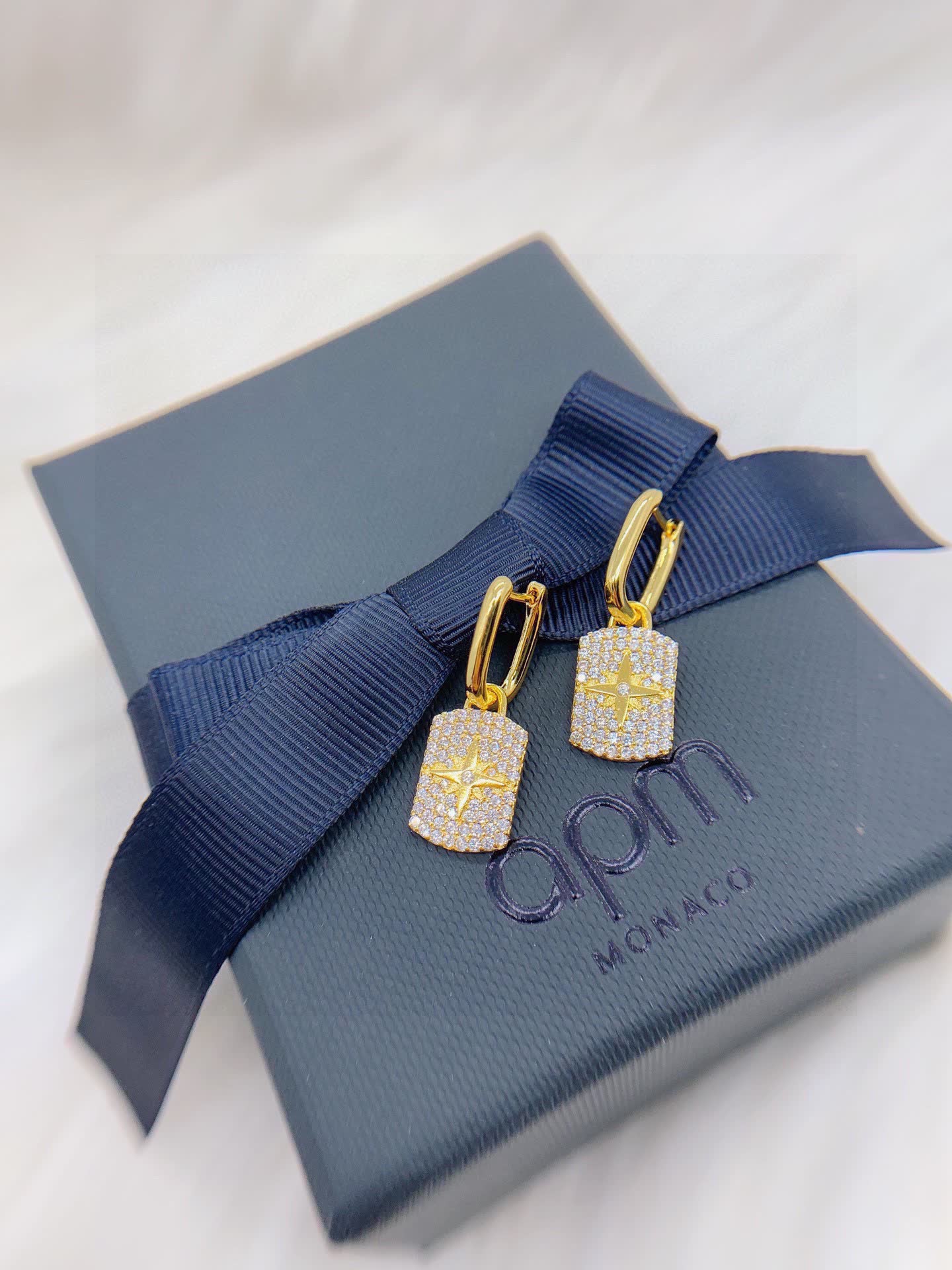 APM Monaco Elegant Gold and Diamond Star Earrings